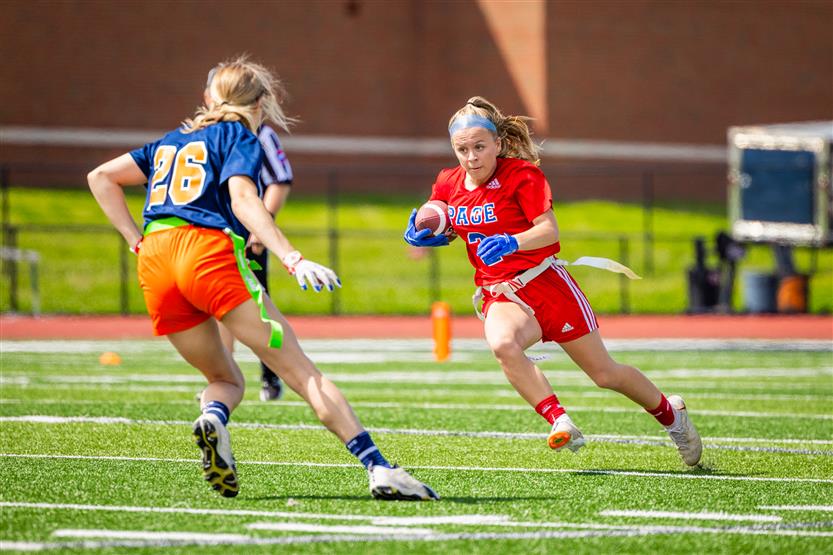 Students play flag football